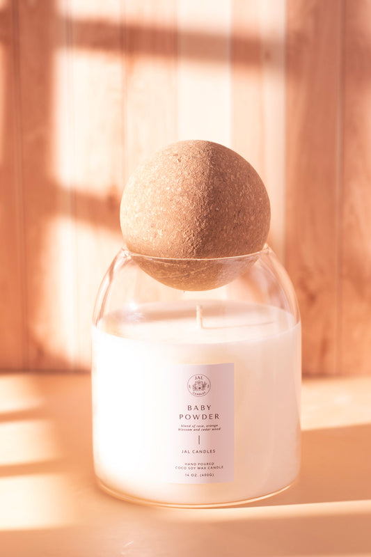 Clear glass jar candle with cork sphere lid and Baby Powder white label