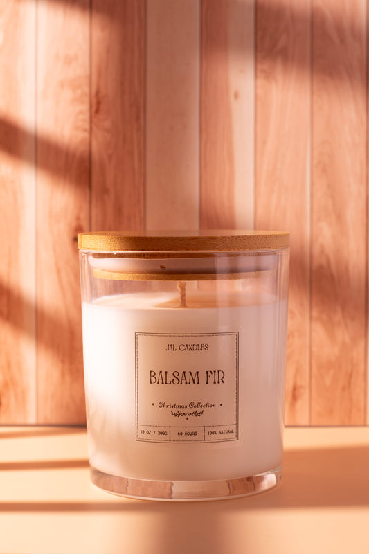 Hand-poured Balsam Fir Christmas candle by JAL Candles, crafted from coconut-soy wax with a wooden lid, photographed in warm festive light, handmade in Cyprus.