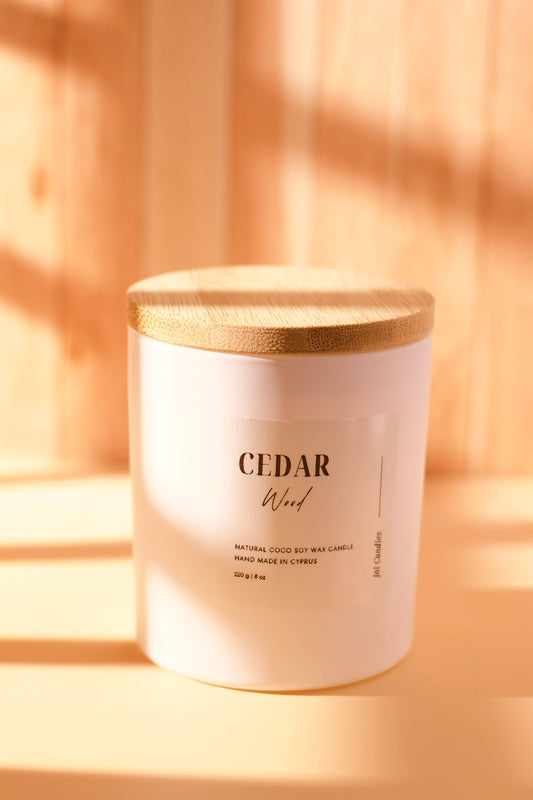 Cedar Wood candle in matte white jar with flat light-wood lid and cream label