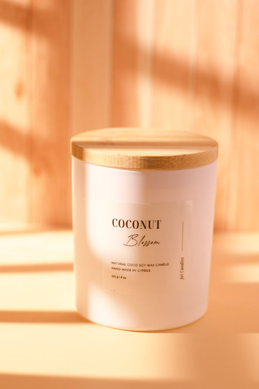 Coconut Blossom candle in matte white jar with flat wood lid and cream label