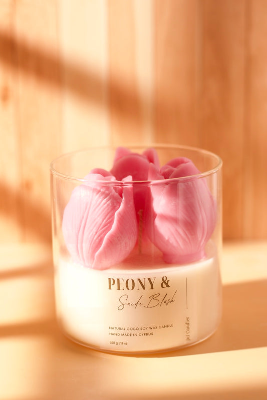 Clear jar topped with three soft-pink wax flower buds, Peony & Soft Blush label