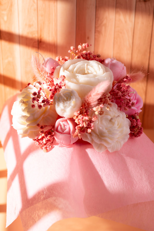 Elegant wax flower bouquet by JAL Candles, featuring pink and white sculpted flowers arranged in soft natural light, handmade in Cyprus.