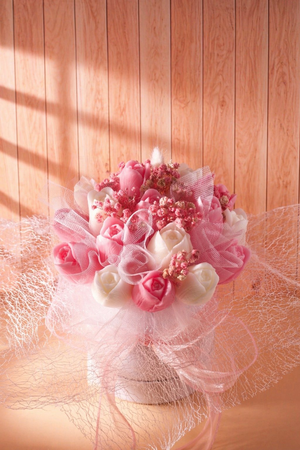 Handmade pink tulip wax flowers close-up in decorative bouquet, elegant candle bouquet Cyprus