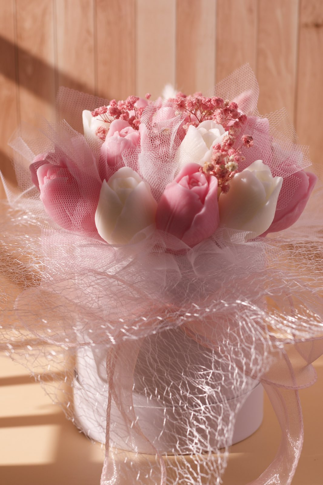 Handmade pink tulip wax flowers close-up in decorative bouquet, elegant candle bouquet Cyprus