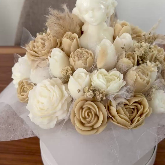 The Grand Bouquet candle bouquet featuring 42 handcrafted wax flowers in ivory and beige tones with an artistic feminine centerpiece, handmade in Cyprus