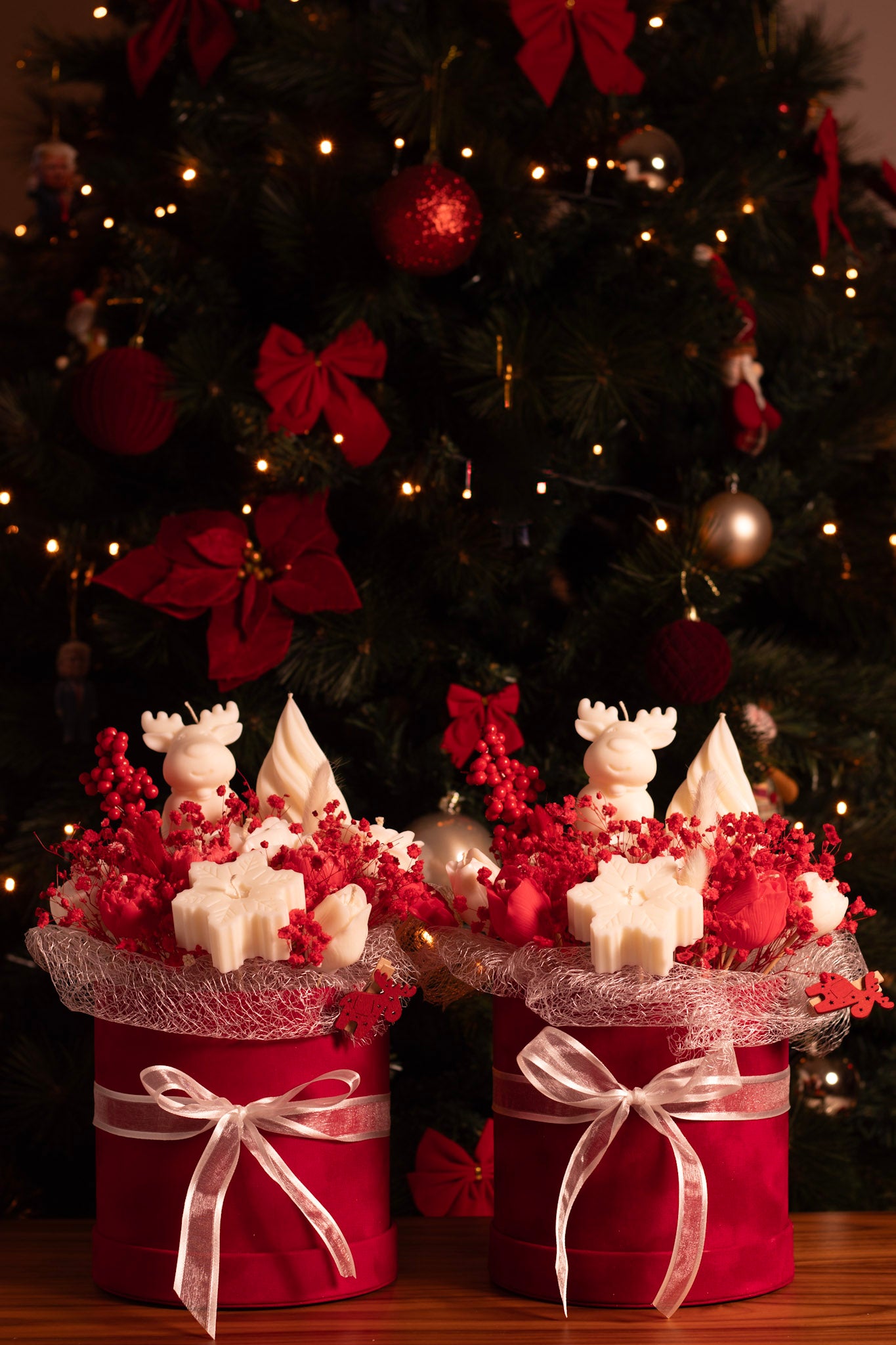 Reindeer's Wonderland handmade Christmas candle bouquet with white sculpted candles, red preserved flowers, golden lights, and red velvet gift boxes